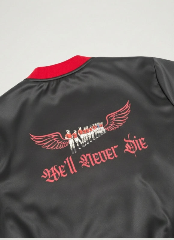 Black jacket with red collar and 'We'll Never Die' text and graphic on a gray background