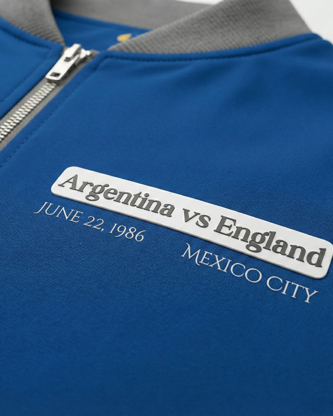 Blue sports jacket with Argentina vs England text on a white background