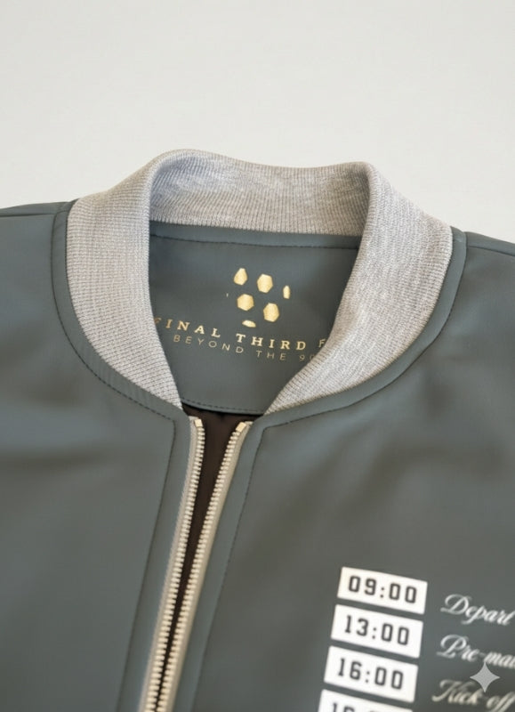 Gray jacket with a brand label on a light gray background
