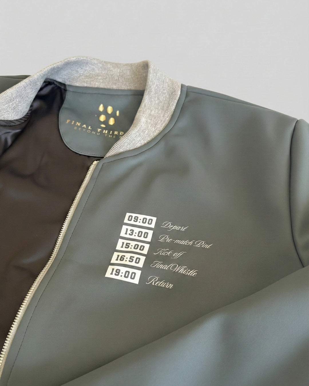 Gray jacket with text design on a light gray background