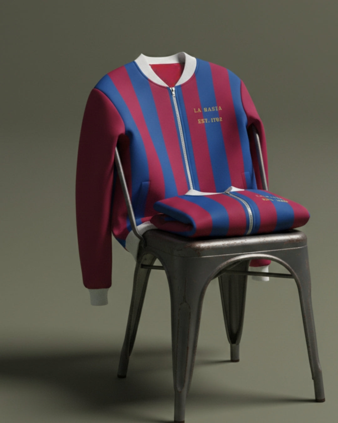 Red and blue striped sweater with white trim on a gray chair against a gray background